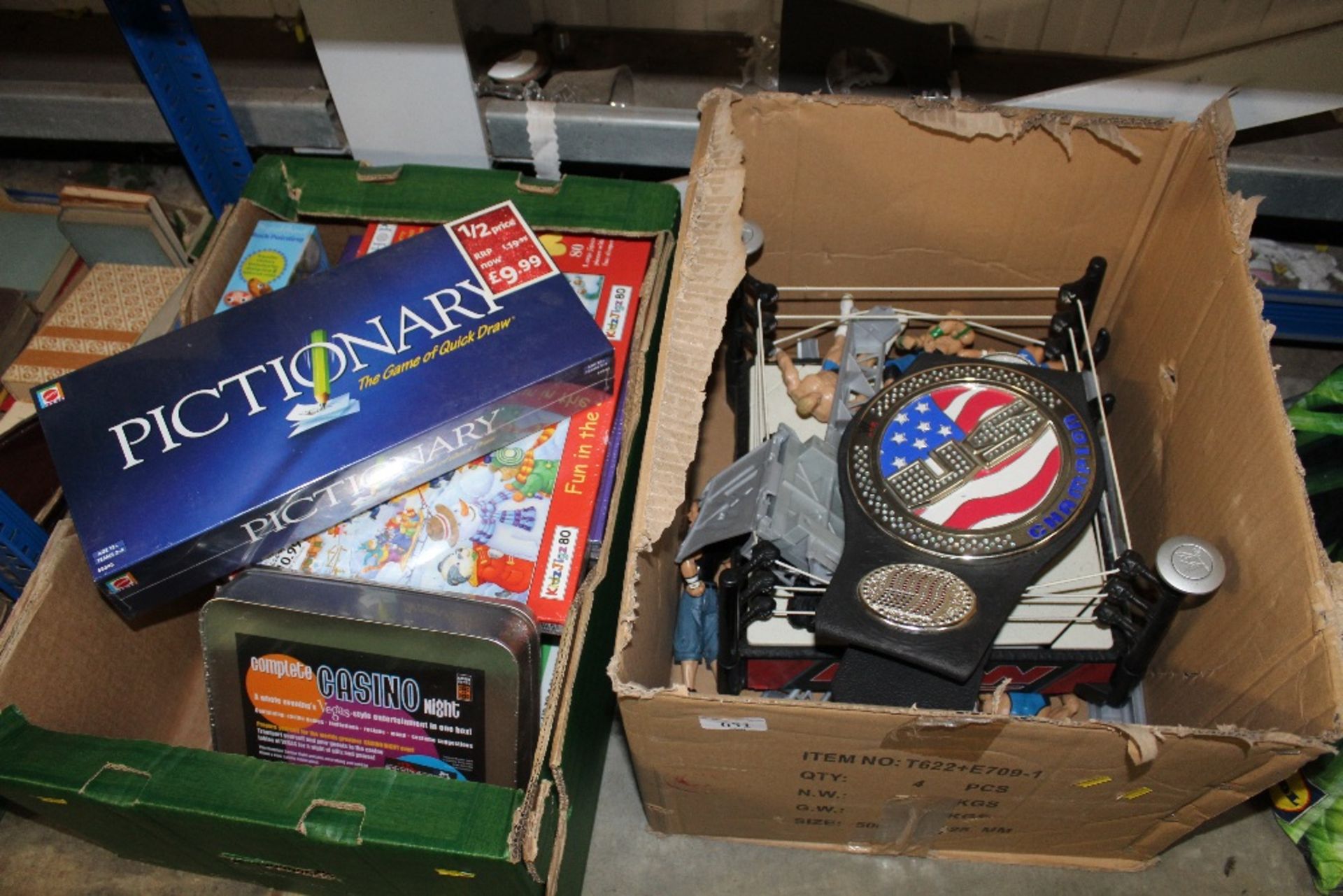 Two boxes of various games and wrestling figures