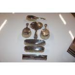 A silver backed dressing table set with one other