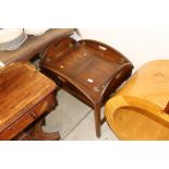 A mahogany Butler's tray type coffee table on stan