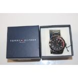 A boxed Tommy Hilfiger wrist watch