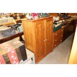 A pine storage cupboard fitted shelves