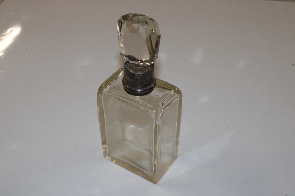 A silver collared decanter and stopper