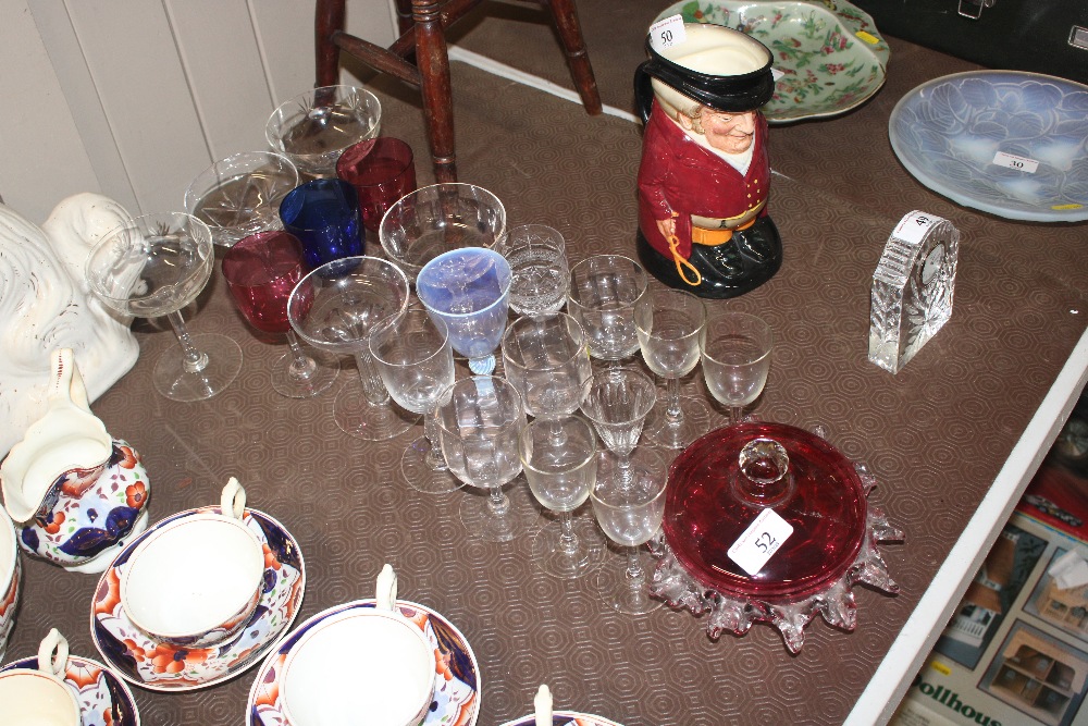 A collection of various table glassware, cranberry