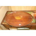 A 19th Century oval mahogany and inlaid tea tray