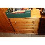 A modern pine chest of three drawers