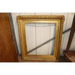 A 19th Century gilt picture frame with foliate scr