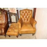 A buttoned tan leather armchair and matching footsto