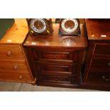 A mahogany bedside chest fitted three drawers