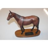 A Beswick horse "Mill Reef" mounted to wooden plin