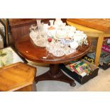 A Victorian circular mahogany snap top dining tabl