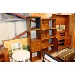 A modern mahogany wall shelf unit fitted three dra