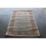 An approx. 5'7" x 3'9" floral patterned rug