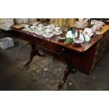 A 19th Century drop leaf table, fitted two drawers