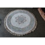 An approx. 4'6" diameter floral patterned wool rug