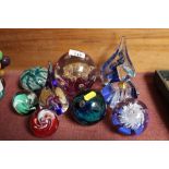 A quantity of paperweights; a scent bottle etc