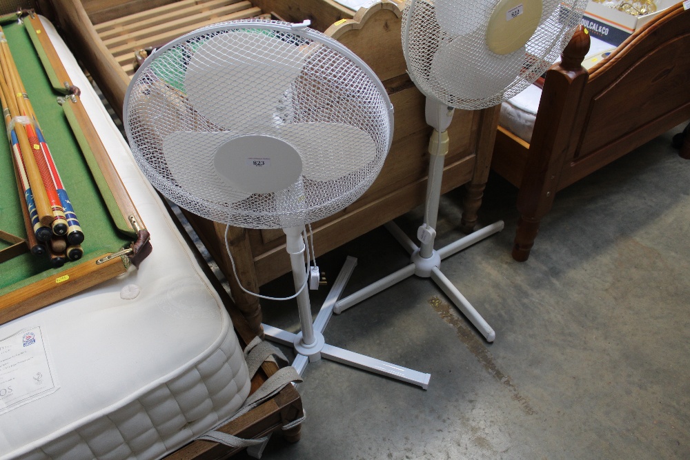 A pedestal desk fan