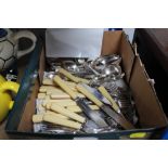 A box of various silver plated and other cutlery