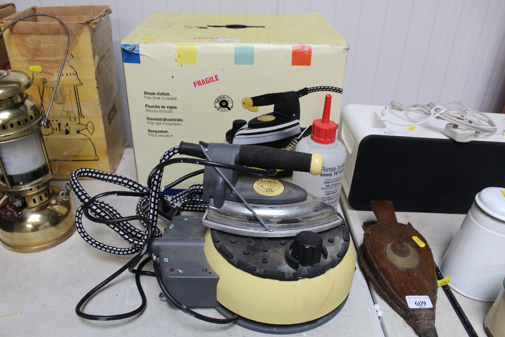 A Laurastar steam iron with original box