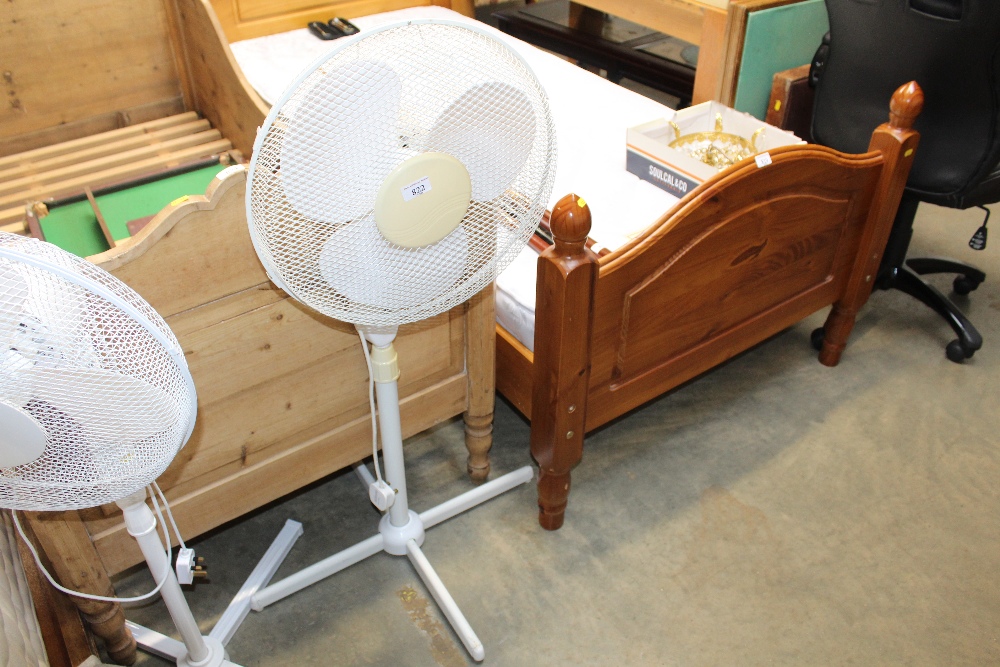 A pedestal desk fan