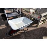 A lightweight galvanised wheelbarrow