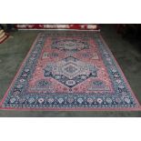 An approx. 9'3" x 6'7" floral patterned rug