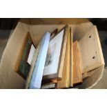 A box containing various picture frames; prints an