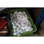 A large quantity of plastic storage jars of small