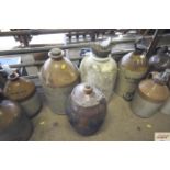 Three medium sized stoneware bottles and jars