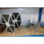 Two Star Wars figures in the form of Tie Fighter a