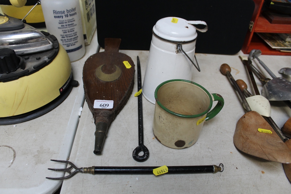 A small pair of bellows; toasting fork; enamel mug