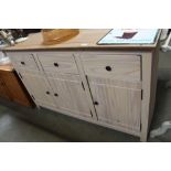 A pine sideboard fitted three drawers