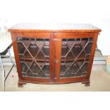 A 19th Century mahogany bow front cabinet with ast