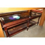 A wooden and glass topped coffee table