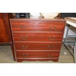 A wood effect chest fitted four long drawers