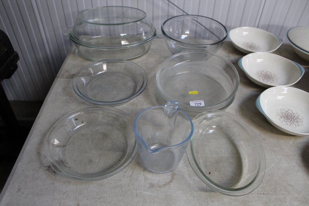 A quantity of glass serving dishes; mixing bowl; m