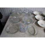 A quantity of glass serving dishes; mixing bowl; m