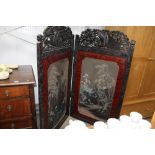 An Oriental carved two fold screen, panels decorate