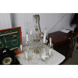 A twelve branch glass chandelier with prism drops,