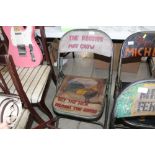 A painted and decorated folding chair