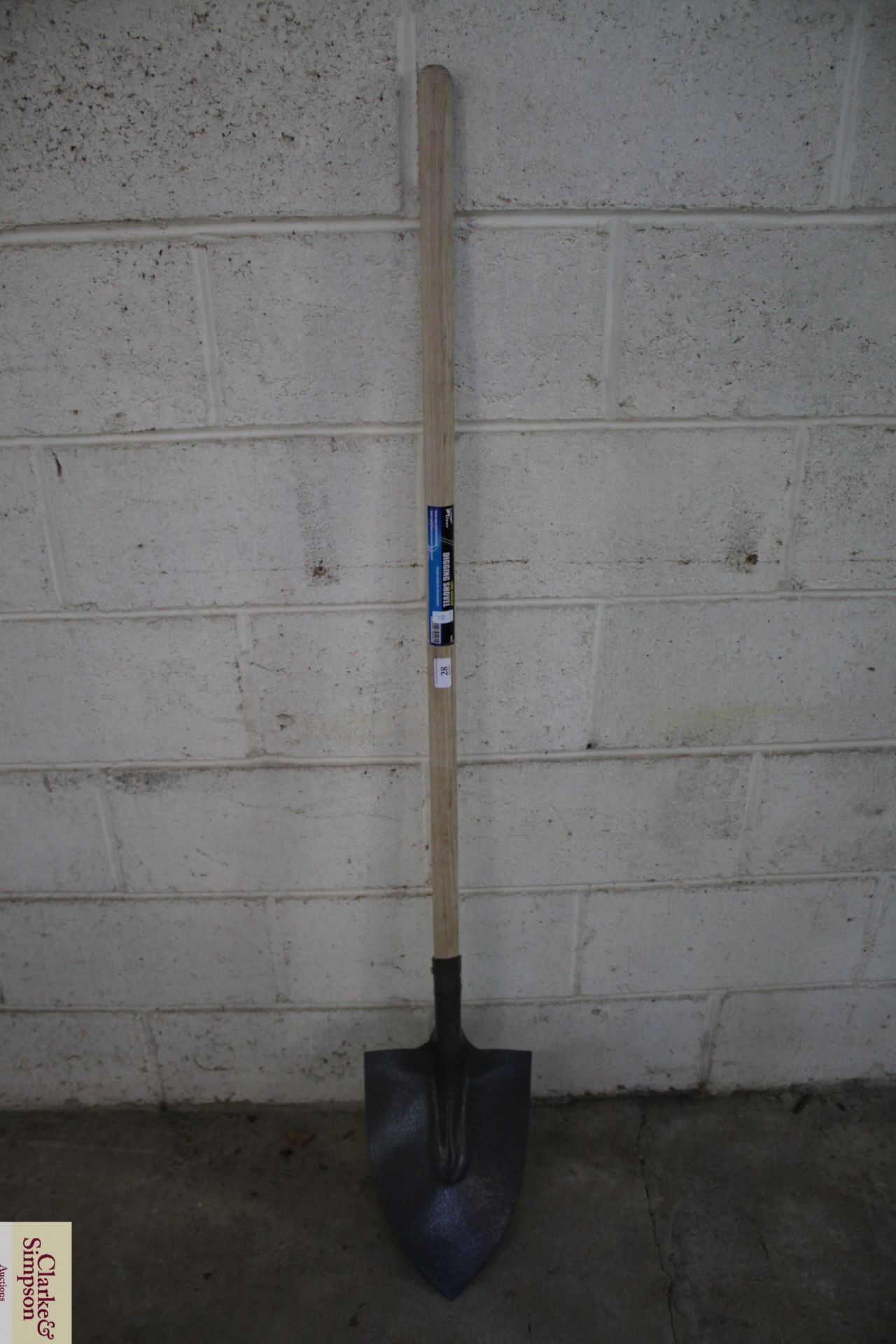 Long handled digging shovel. V