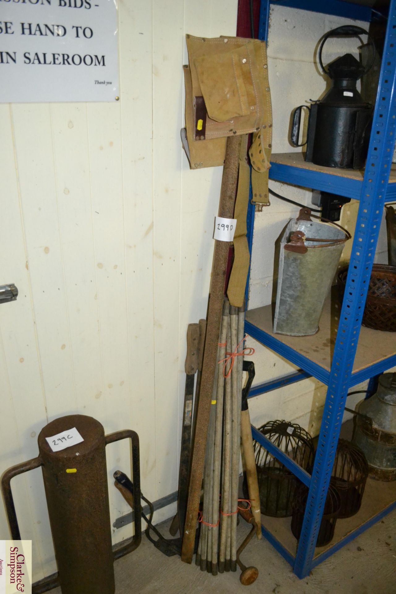 Quantity of drain rods and various other hand tools.
