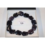 A blue and purple stone costume necklace