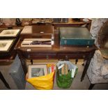 A mahogany side table having gallery top, fitted t