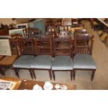 Four Edwardian carved dining chairs with blue Dral