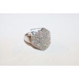 A 9ct white gold and chip diamond set ring