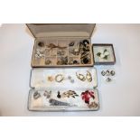 A collection of costume brooches and clip ear-ring