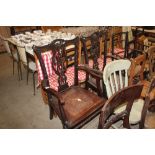 A pair of mahogany Chippendale style elbow chairs