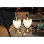A large pair of ceramic and brass mounted baluster