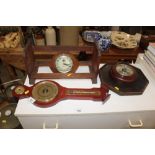 A vintage Smith alarm clock, a book rack, two baro