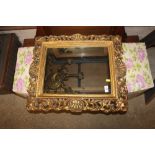 A gilt framed wall mirror